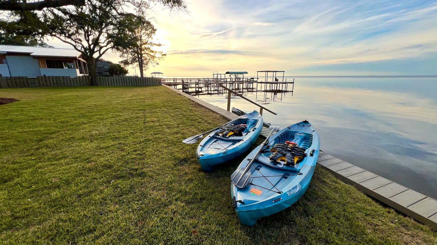 Sunset over the bay behind a short-term rental home in Gulf Breeze, Florida